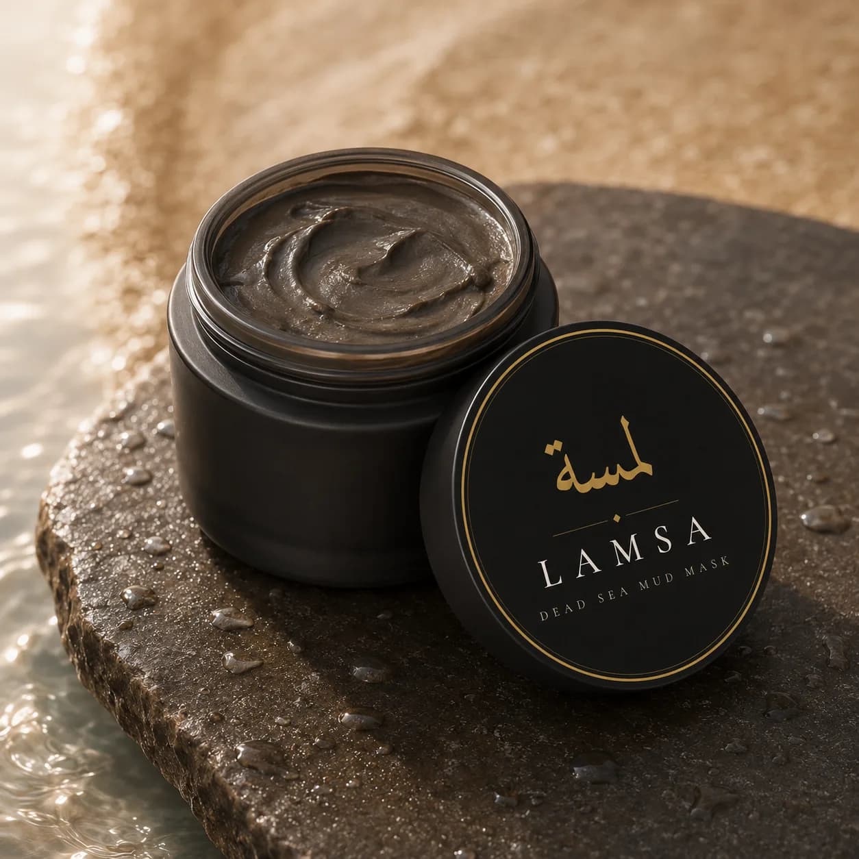 Lamsa jar open, revealing dark mineral Dead Sea mud